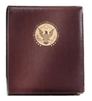 Burgundy-colored padded cover ring binder